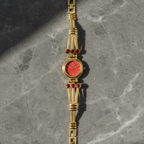 Coral Dial Gold-Tone Bracelet Watch with Ruby Crystal Accents