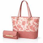 Black cow print tote bag with comfortable shoulder handles and a matching pouch for daily essentials