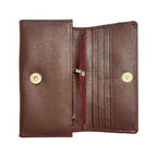 Flat lay of Riva brown clutch wallet – leather finish with minimal design