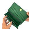 Interior of Aluna green wallet showing card slots and spacious compartments