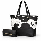Women’s cow print tote bag set with a spacious main bag and coordinated pouch in a bold black pattern