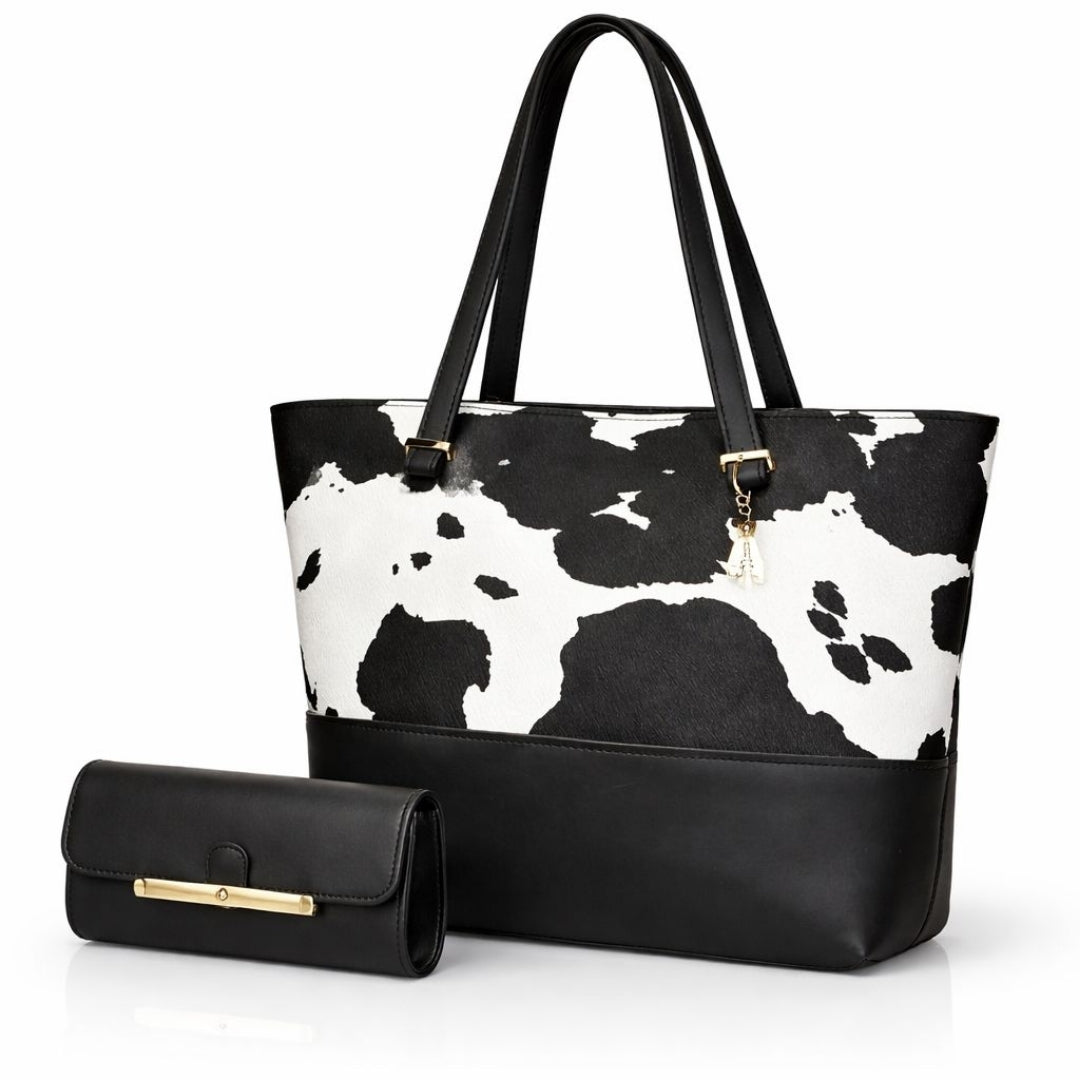 Women’s cow print tote bag set with a spacious main bag and coordinated pouch in a bold black pattern