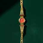 Coral Dial Gold-Tone Bracelet Watch with Ruby Crystal Accents