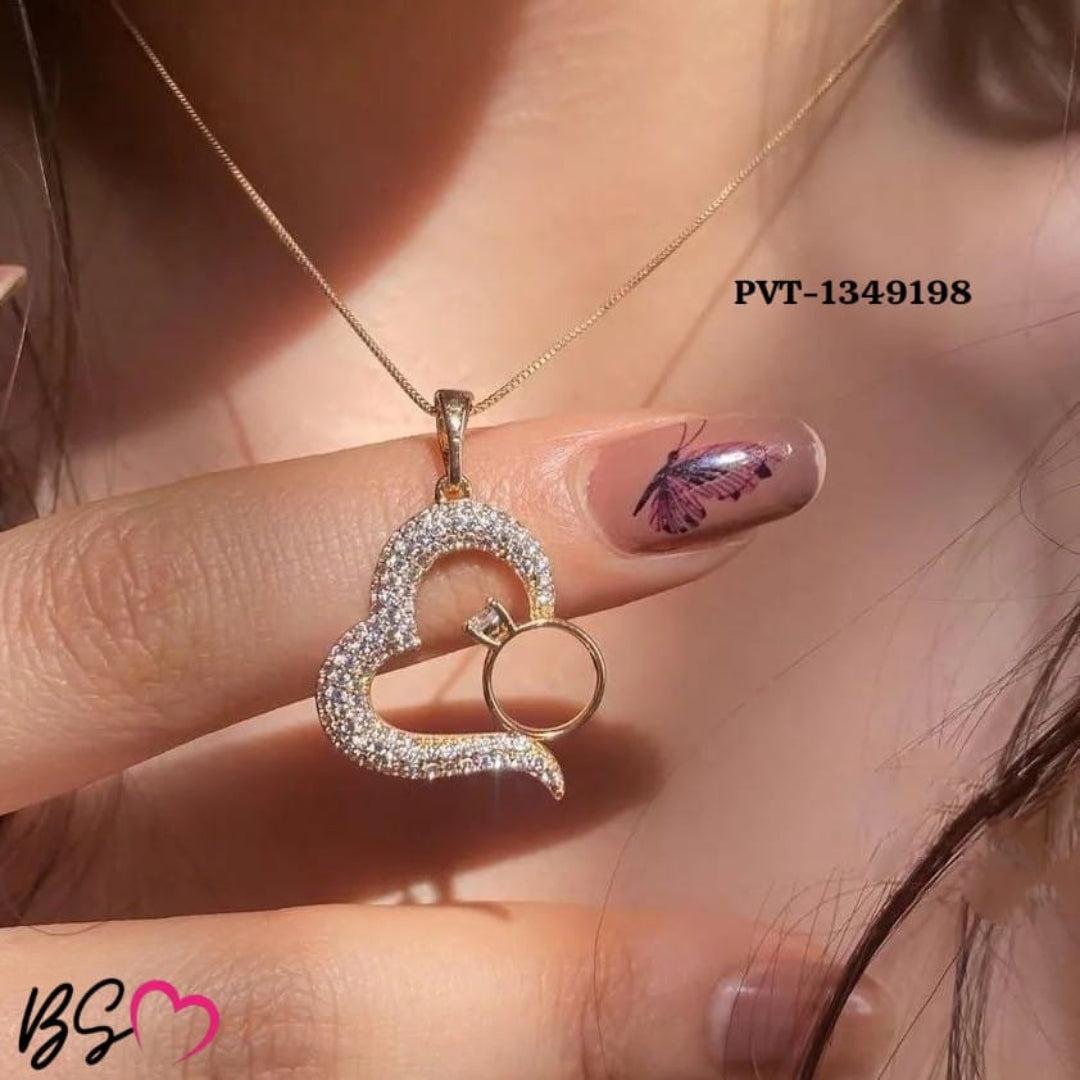 Golden heart and ring pendant adds a delicate touch to everyday looks.